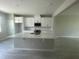 Bright kitchen featuring white cabinets, a functional center island with sink, and modern finishes at 1411 Mount Royal Dr, St Cloud, FL 34771