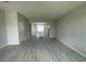 Open-concept living area with tile flooring, neutral paint, and seamless transition into the modern kitchen at 1411 Mount Royal Dr, St Cloud, FL 34771