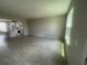 Bright living room with large windows and tile floors, perfect for modern living and relaxation at 1411 Mount Royal Dr, St Cloud, FL 34771