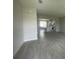Open concept living space with tile floors that lead to a modern kitchen, ideal for entertaining at 1411 Mount Royal Dr, St Cloud, FL 34771