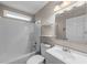 Well-maintained bathroom features a shower-tub combo, a vanity, and a large mirror at 1413 Brookebridge Dr, Orlando, FL 32825