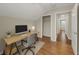 This office/bedroom features wood floors, neutral walls, and an alcove closet at 1413 Brookebridge Dr, Orlando, FL 32825