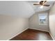 Bright bedroom with dark wood floors, ceiling fan, and window offering natural light at 1413 Brookebridge Dr, Orlando, FL 32825
