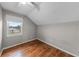 Simple bedroom with wood-look floors, natural light from a window, and a ceiling fan at 1413 Brookebridge Dr, Orlando, FL 32825