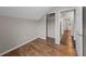 Bright bedroom featuring wood floors, an alcove closet and views to additional rooms at 1413 Brookebridge Dr, Orlando, FL 32825