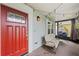 Inviting front porch with hanging chair and string lights, perfect for relaxing outdoors at 1413 Brookebridge Dr, Orlando, FL 32825