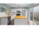 Modern kitchen with stainless steel appliances, granite counters, and a central island at 1413 Brookebridge Dr, Orlando, FL 32825