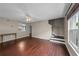 Spacious living room featuring hardwood floors, a ceiling fan, and a staircase at 1413 Brookebridge Dr, Orlando, FL 32825