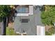 Aerial view of a green roof, a screened-in pool and a large canopy at 14612 Bray Rd, Orlando, FL 32832