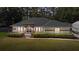 Charming single-story home with an arched entryway and beautiful landscaping at 14612 Bray Rd, Orlando, FL 32832