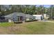 Charming home featuring a well-manicured lawn with lush landscaping and a detached garage at 14612 Bray Rd, Orlando, FL 32832