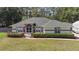 Traditional home with arched windows, neat landscaping, and lush green lawn at 14612 Bray Rd, Orlando, FL 32832