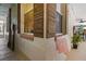 Covered lanai exterior corner shows a peek of the outdoor space and greenery at 14612 Bray Rd, Orlando, FL 32832