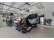 Organized garage space with epoxied floors and ample room for storage and a golf cart at 14612 Bray Rd, Orlando, FL 32832