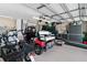 Spacious garage with epoxied floors, golf cart, and plenty of room for storage at 14612 Bray Rd, Orlando, FL 32832