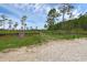 Community entrance with a wire fence and gate. A sign indicates the community hours of operation at 14612 Bray Rd, Orlando, FL 32832