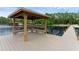 Waterfront gazebo featuring built-in benches and easy water access with ladders at 14612 Bray Rd, Orlando, FL 32832