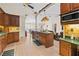 Spacious kitchen featuring an island, custom cabinets, and an open layout at 14612 Bray Rd, Orlando, FL 32832