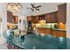 Kitchen featuring custom wood cabinets, large island, and stainless steel appliances at 14612 Bray Rd, Orlando, FL 32832