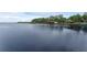 Expansive lake view featuring waterfront homes, docks, and tranquil blue waters at 14612 Bray Rd, Orlando, FL 32832