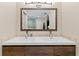 Main bathroom featuring double sinks and a large mirror at 14612 Bray Rd, Orlando, FL 32832
