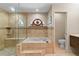 Main bathroom featuring a soaking tub, walk-in shower, decorative tile, and stained glass at 14612 Bray Rd, Orlando, FL 32832