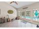Sunroom featuring tile floors and French doors leading to the pool area at 14612 Bray Rd, Orlando, FL 32832