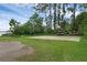Community recreation area with a basketball court, picnic table, and kayak storage racks at 14612 Bray Rd, Orlando, FL 32832