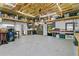 Spacious workshop with ample storage, cabinets, and workspace with doors leading to the outside at 14612 Bray Rd, Orlando, FL 32832