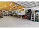 Large workshop area with ample lighting, storage, and workspace for various projects at 14612 Bray Rd, Orlando, FL 32832