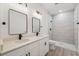 Elegant bathroom with double vanity, quartz countertops, and a spacious, tiled walk-in shower at 14930 Sw 66Th Ave Rd, Ocala, FL 34473