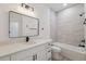 Bathroom featuring a single vanity, white countertops, and a shower/tub combo with tiled walls at 14930 Sw 66Th Ave Rd, Ocala, FL 34473