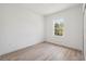 Bright bedroom features a window offering ample natural light and neutral paint at 14930 Sw 66Th Ave Rd, Ocala, FL 34473