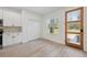 Well-lit kitchen area with wooden door, ample cabinets, and countertops with stainless steel appliances at 14930 Sw 66Th Ave Rd, Ocala, FL 34473