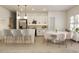 A modern, updated kitchen features white cabinetry, stainless steel appliances, and a breakfast bar for seating at 14930 Sw 66Th Ave Rd, Ocala, FL 34473