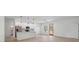 Modern kitchen features stainless steel appliances, white cabinetry, and a quartz countertop island at 14930 Sw 66Th Ave Rd, Ocala, FL 34473