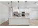 Spacious kitchen with quartz countertops, stainless steel appliances, and sleek white cabinetry at 14930 Sw 66Th Ave Rd, Ocala, FL 34473