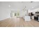 Open-concept living space leading into kitchen features plenty of room to enjoy at 14930 Sw 66Th Ave Rd, Ocala, FL 34473