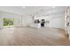 An open concept living space features a modern kitchen with quartz countertops at 14930 Sw 66Th Ave Rd, Ocala, FL 34473
