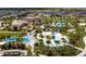 Aerial view of the community showcasing the water park, swimming pools, and lush landscaping at 1505 Nassau Point Trl, Kissimmee, FL 34747