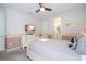 Comfortable bedroom with ensuite bathroom access, a TV, and soft, neutral color scheme at 1505 Nassau Point Trl, Kissimmee, FL 34747