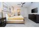 Modern bedroom featuring a ceiling fan, TV, dresser, and access to the ensuite bathroom at 1505 Nassau Point Trl, Kissimmee, FL 34747
