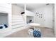 Bunkroom featuring creative built-in bunk beds, carpet, and nautical accents for a playful retreat at 1505 Nassau Point Trl, Kissimmee, FL 34747