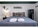 Themed bedroom featuring a cozy bed, football decorations, and ample storage space at 1505 Nassau Point Trl, Kissimmee, FL 34747