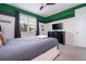 Stylish bedroom with unique sports themed decor, perfect for a fan at 1505 Nassau Point Trl, Kissimmee, FL 34747