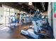 Well-equipped gym with treadmills, weight machines and dark ceilings with exposed duct work at 1505 Nassau Point Trl, Kissimmee, FL 34747