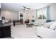 Inviting living area with ample seating, a ceiling fan, and a foosball table for recreation at 1505 Nassau Point Trl, Kissimmee, FL 34747