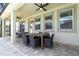 Covered patio with dining set and outdoor furniture at 1505 Nassau Point Trl, Kissimmee, FL 34747