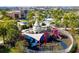 Aerial shot of a modern playground with slides, climbing structures, and shaded areas for entertainment at 1505 Nassau Point Trl, Kissimmee, FL 34747