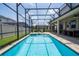 Screened-in pool area with a sparkling pool and inviting outdoor space at 1505 Nassau Point Trl, Kissimmee, FL 34747